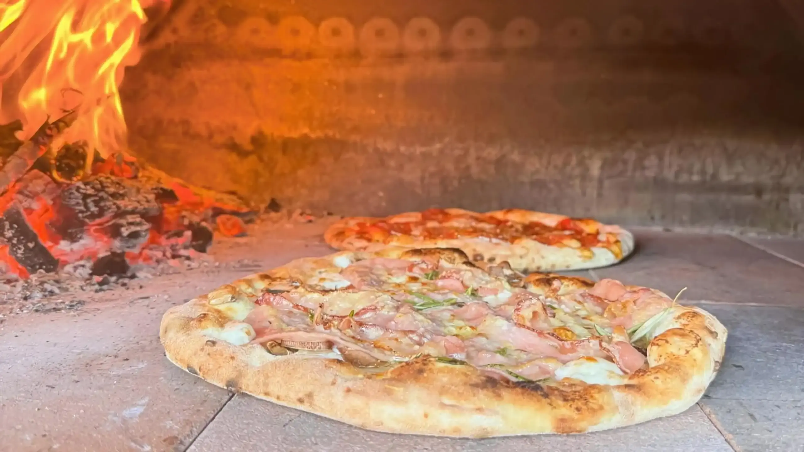 Wood-fired Napoletana pizza in the oven
